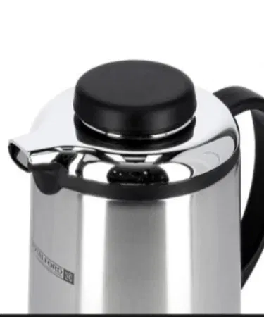 Silver 1-liter stainless steel thermos flask with press button and glass refill sold in Pakistan