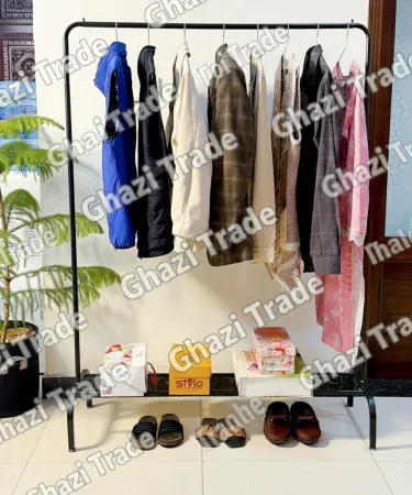 Elegant black metal cloth hanging stand with bottom storage rack for shoes and bags Pakistan