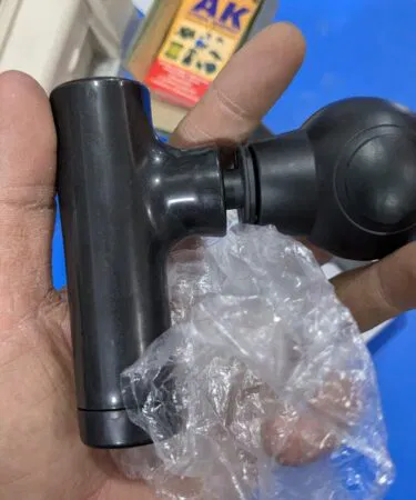Portable mini massage gun for athletes, pain relief, and muscle recovery. Compact and deep tissue percussion.