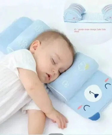 Baby anti-roll head support pillow for comfortable sleep and healthy development, preventing flat head syndrome.