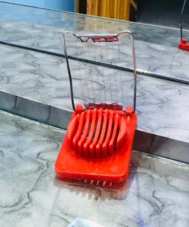Boiled egg slicer and cutter for easy meal preparation, available in Pakistan