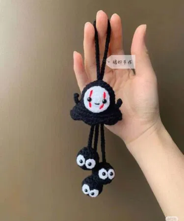 Handmade black crochet ghost keychain with triple mini ghost charms, ideal for Pakistan.