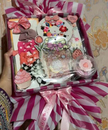 Customized Pink Candy Surprise gift pack with hair accessories, snacks, and goodies, available in Pakistan.