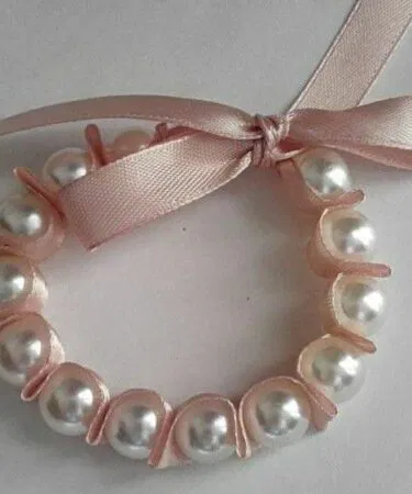 Handmade beads and ribbon bracelet, elegant adjustable wrist accessory for women, sold in Pakistan
