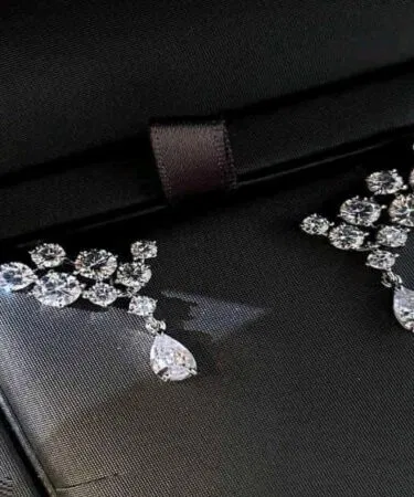 Imported teardrop dangling statement earrings with cubic zirconia, silver plated alloy, for women in Pakistan.