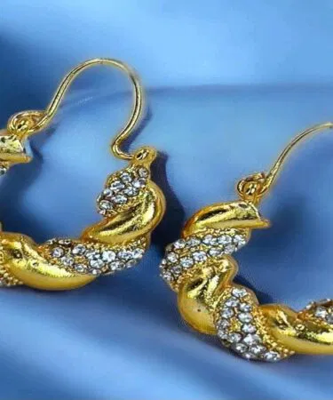 Women's golden twist hoop earrings with crystal embellishments, synthetic imitation copper alloy, party wear, sold in Pakistan