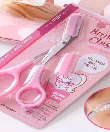 Pink stainless steel eyebrow scissors with comb for women sold in Pakistan