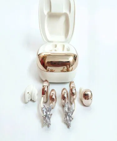 Rose gold wireless earbuds with charging case, pink and white, unisex, C-type connectivity, 100-hour playtime