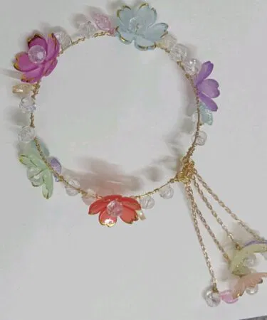 Elegant women's Qara hair accessories with flower and crystal embellishments, adjustable, easy to wear