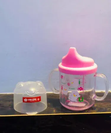 Baby training cup with lid, BPA-free, easy to hold, spill-proof spout, anti-colic vent, sold in Pakistan