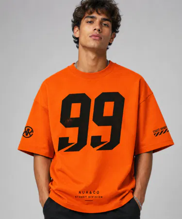 Men's orange oversized baggy graphic t-shirt with black 99 print, cotton blend, sold in Pakistan
