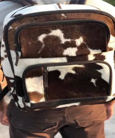 Genuine hair-on cowhide leather handmade rucksack, Western Boho style, unisex, zip closure, white/brown, sold in Pakistan