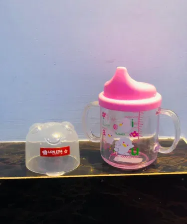 Baby training cup with lid, BPA-free, easy to hold, spill-proof spout, anti-colic vent, sold in Pakistan