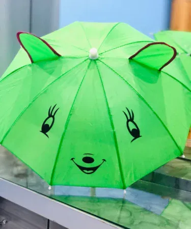 Small kids cartoon umbrella in multi-colour, random design, suitable for ages 4-10, sold in Pakistan