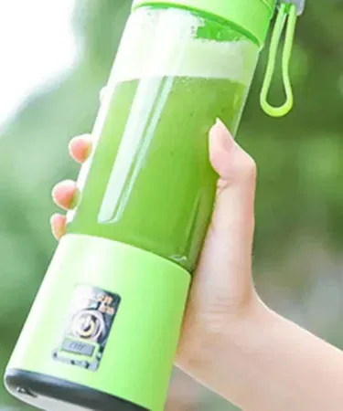 Portable 380ML rechargeable juicer blender with 6 stainless steel blades, USB powered, ideal for smoothies and dry fruits.