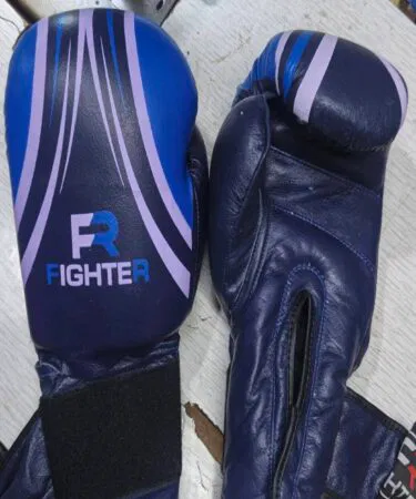 Premium black cowhide leather boxing gloves with custom screen printing, unisex, 10oz-12oz, by Figther, sold in Pakistan