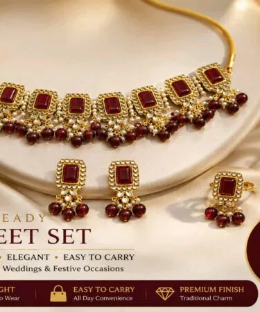 Handmade Kundan jewellery set with red stones and pearls, antique gold finish, for women in Pakistan