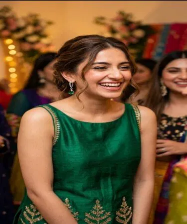 Elegant emerald green teardrop leverback hoop earrings with cubic zirconia, crafted from copper and crystal, sold in Pakistan