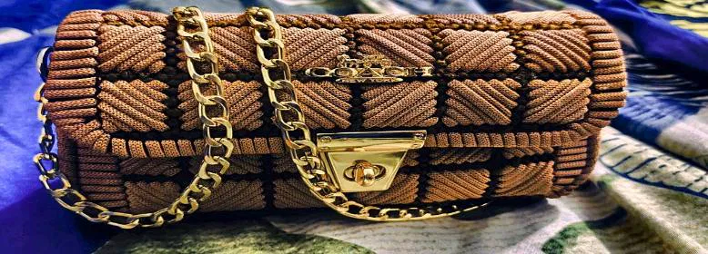 Light pinkish brown handmade woven macrom canvas clutch bag with gold chain for women sold in Pakistan