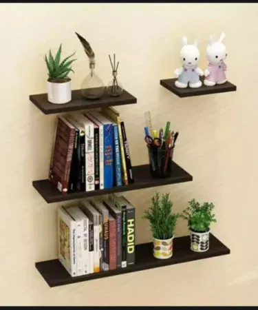 White and black wooden floating shelves for wall mounting and book storage.
