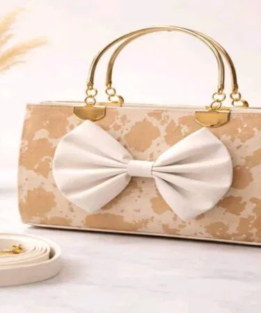 Peach leather bow shoulder bag for women, 8x10 inches, plain pattern, sold in Pakistan