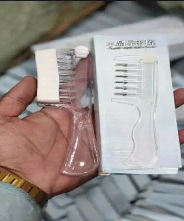 Transparent crystal liquid applicator comb for even hair liquid application, sold in Pakistan.
